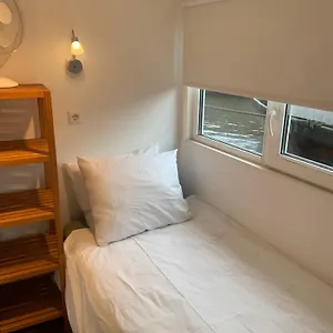 Tiny Houseboat On The Amstel River Amsterdam